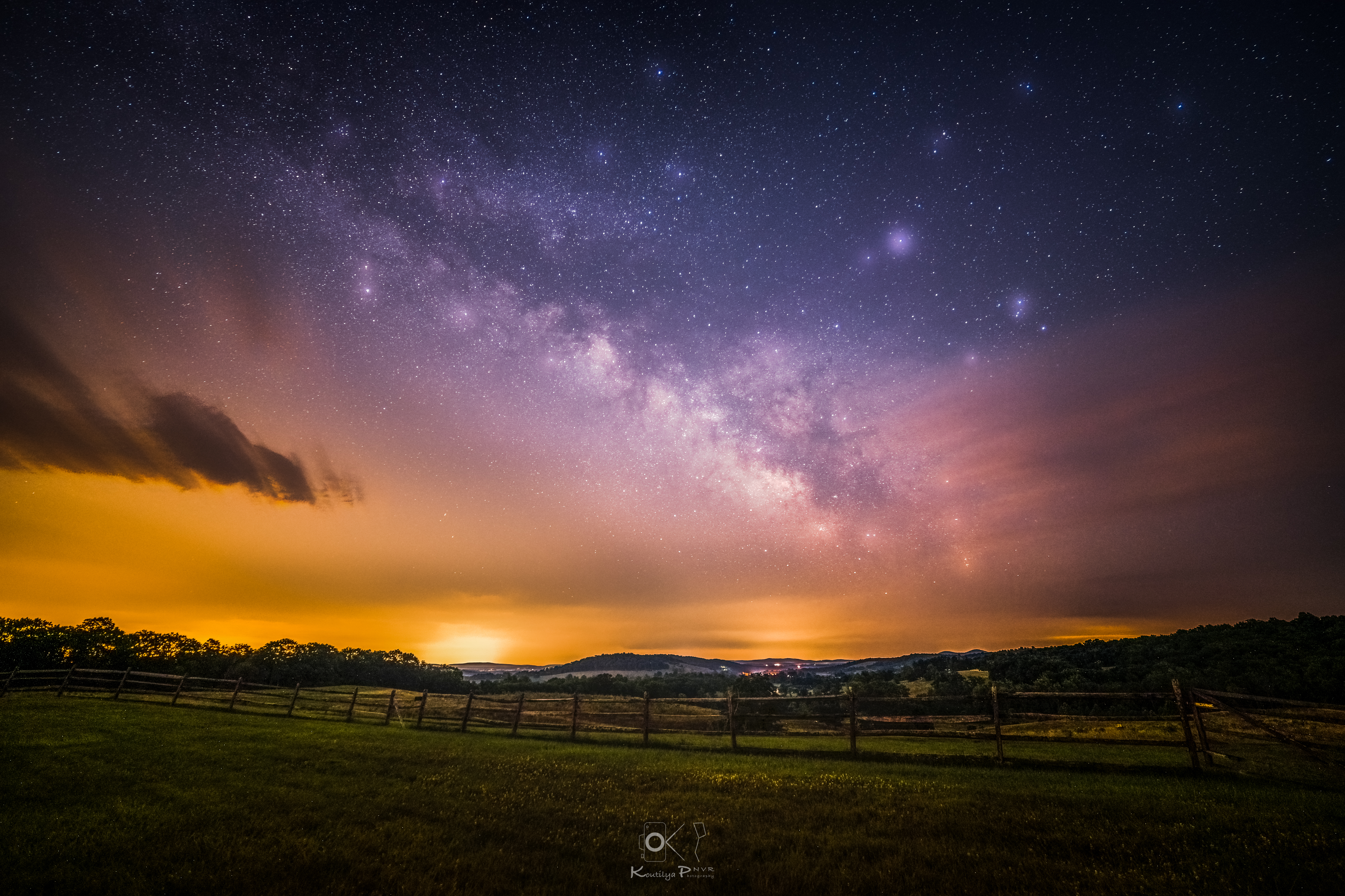 Stars in the sky during a sunset over farmland