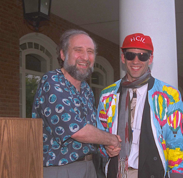 Photo of Shneiderman (left) handing off the HCIL directorship to Bederson (right)