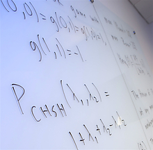 White board with equations