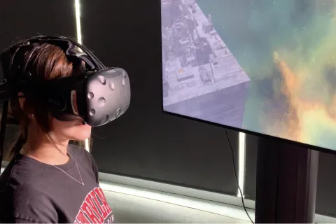 girl in VR headset viewing spaceport