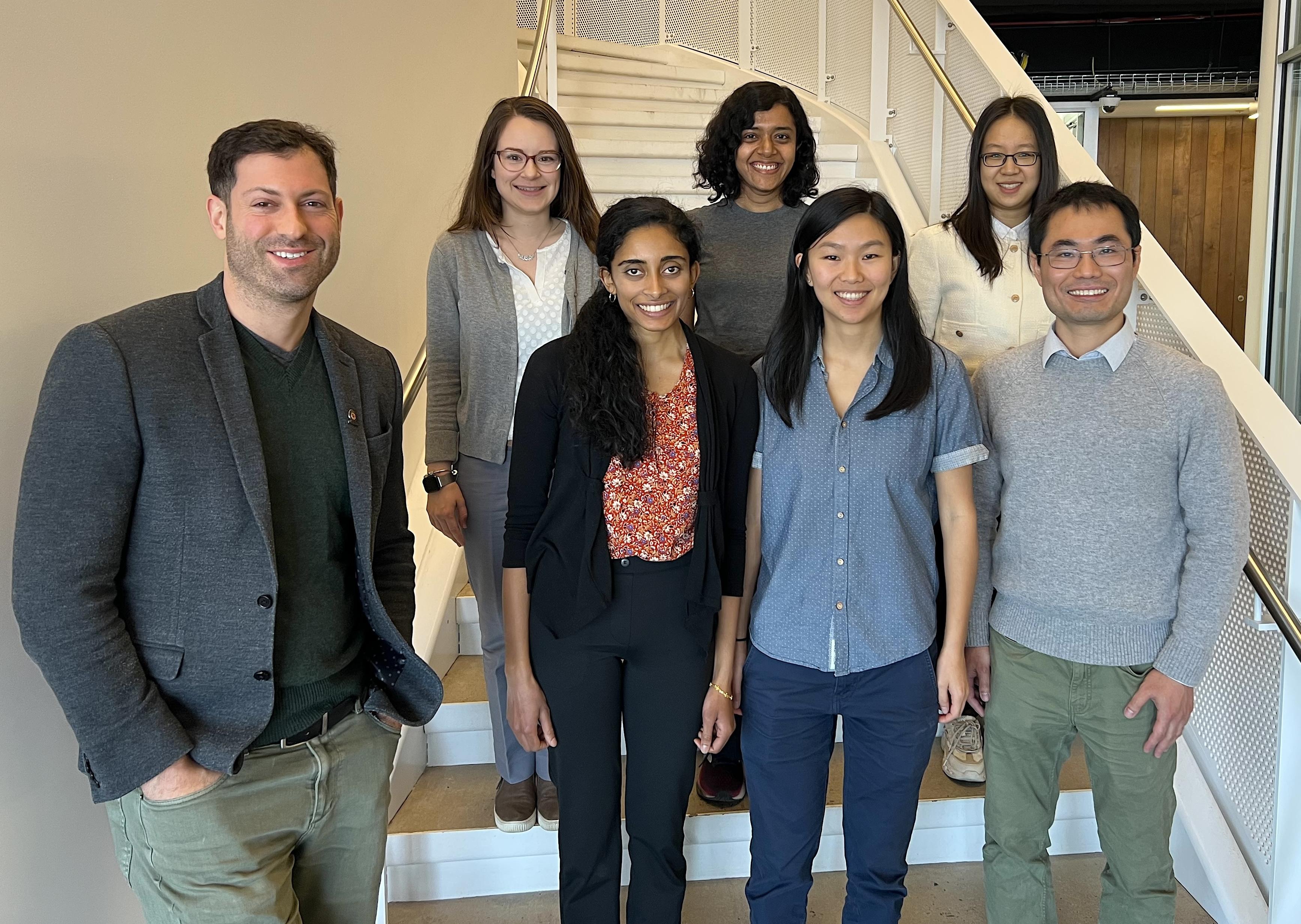 A photo of Tom Goldstein with the six awardees for the 2024 Rising Stars in Machine Learning program .