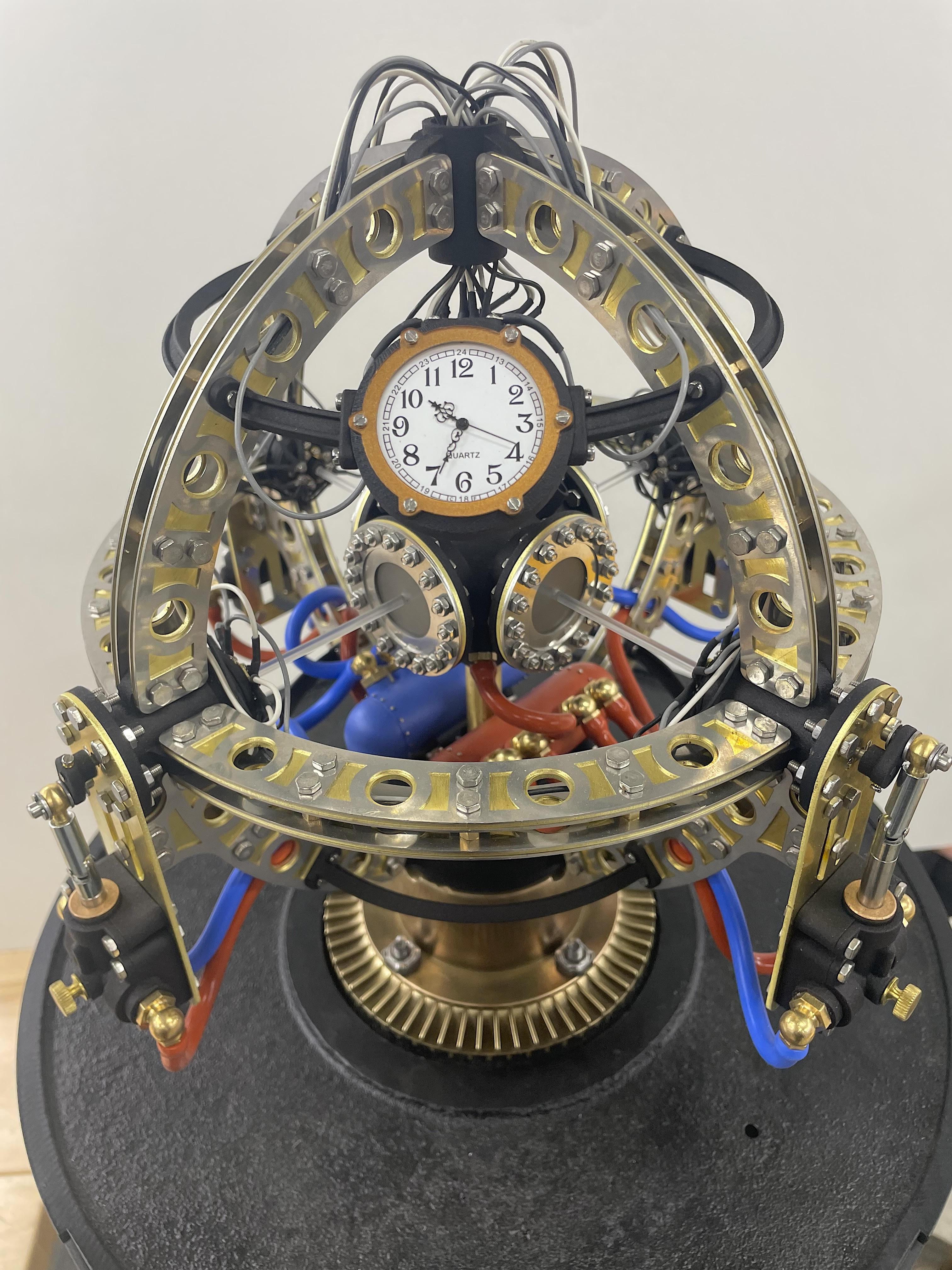 An eight-inch in diameter sculpture blending steampunk’s brass and gears with the mind-bending world of quantum physics.