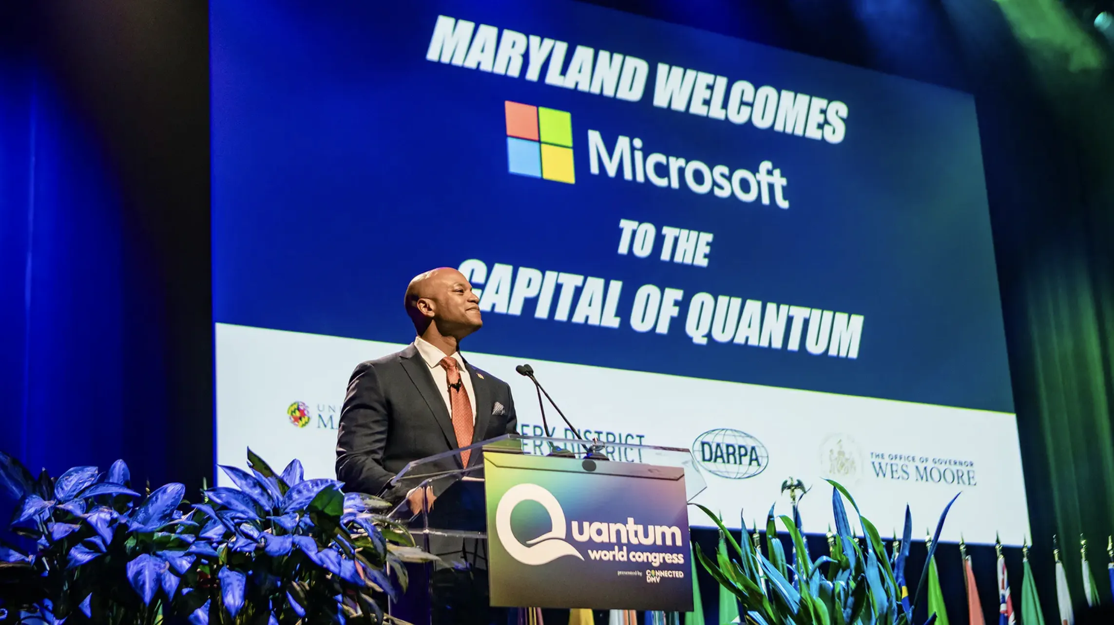 Maryland Gov. Wes Moore stands in front of Microsoft and Capital of Quantum sign